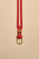 Close-up of the buckle on Aeris Classic Red Leather Dog Collar, featuring high-quality brass hardware and Italian craftsmanship