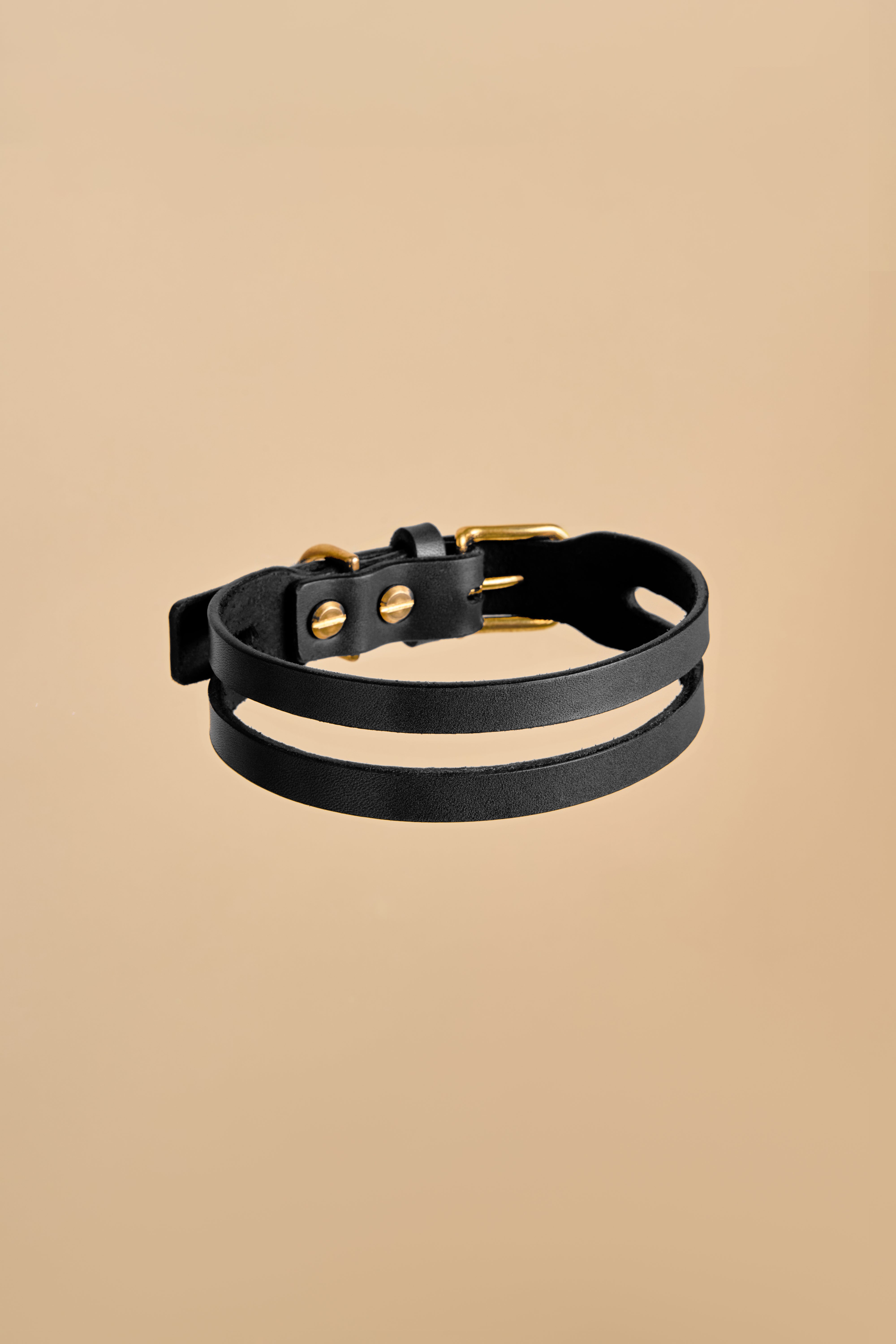 Aeris Classic Black Leather Dog Collar made from premium Italian leather with rust-resistant brass hardware, offering elegance and durability.