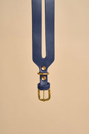 Detailed view of the buckle on Aeris Wide Blue Dog Collar, featuring strong brass hardware and durable Italian leather