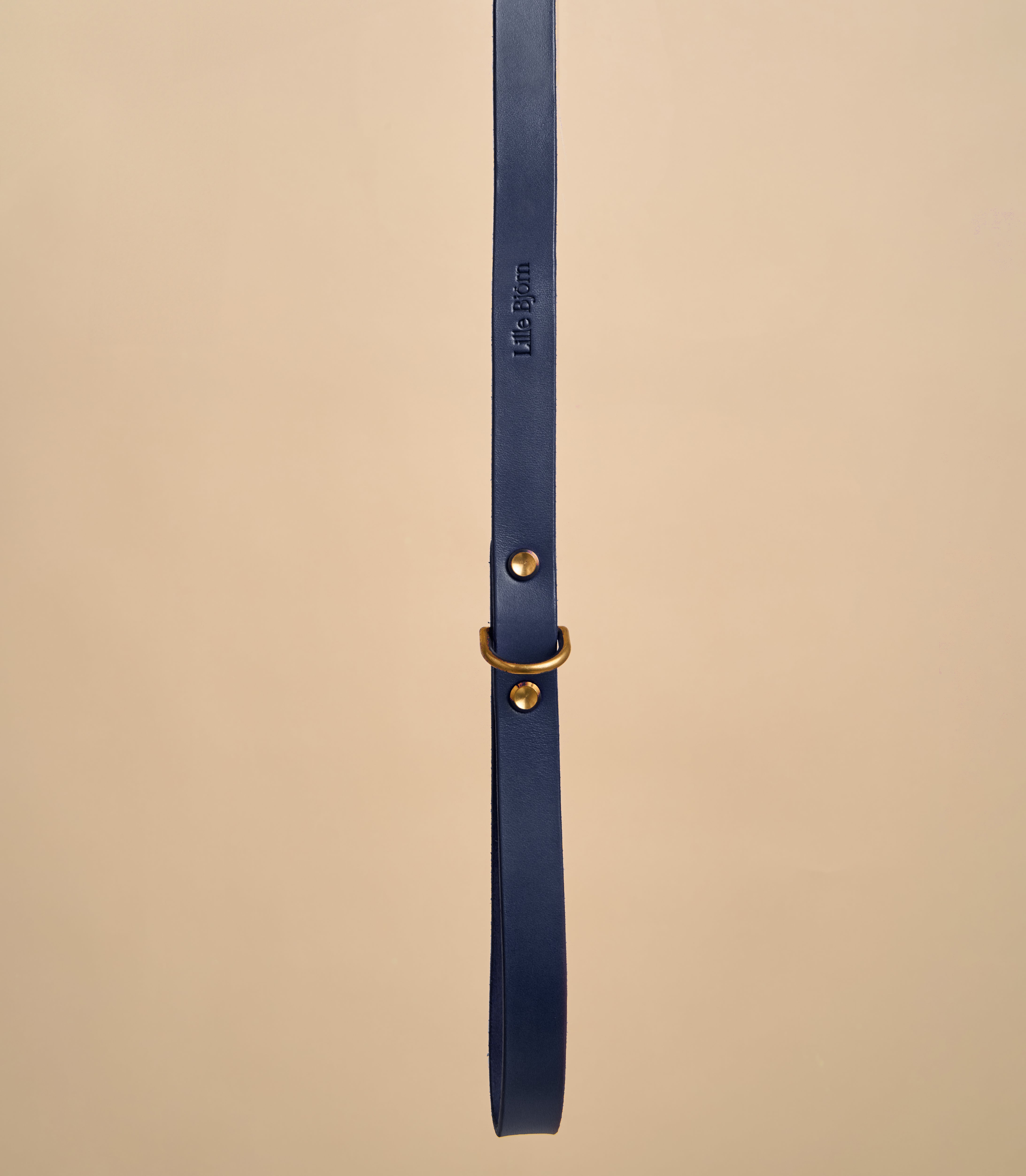 Close-up detail of Classic Blue Leather Dog Leash handle with embossed design, crafted from high-quality Italian leather and brass hardware