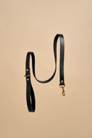 Classic Black Leather Dog Leash made from premium Italian leather with durable brass hardware, offering a sleek and timeless design for stylish and reliable walks.