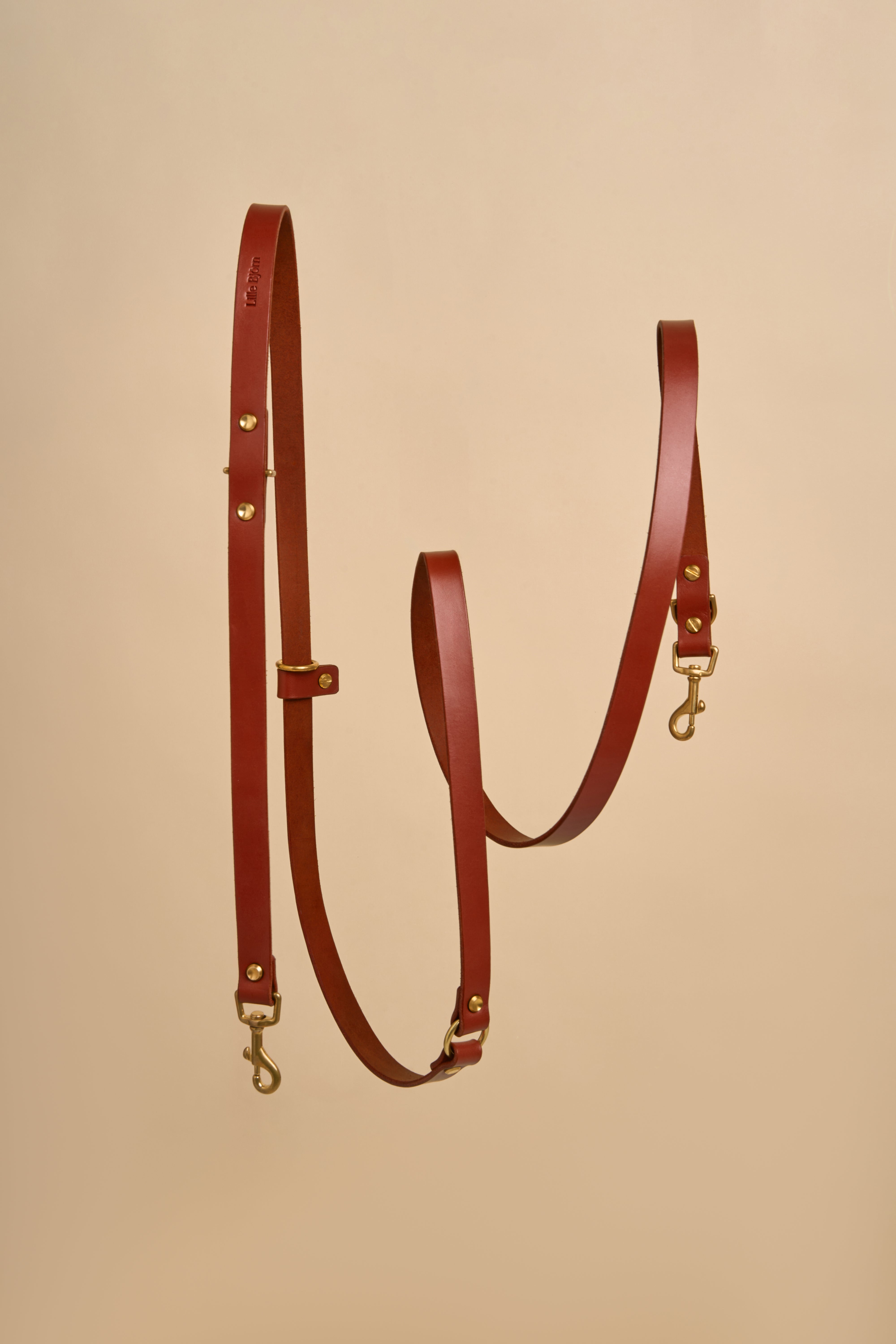 Omni Cognac Leather Dog Leash designed for hands-free and cross-body use, made from luxurious Italian leather with durable brass hardware, offering a stylish and adaptable solution for walking your dog