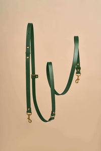 Omni Green Leather Dog Leash with hands-free and cross-body functionality, crafted from premium Italian leather and featuring strong brass fittings, providing a versatile and fashionable option for dog walks