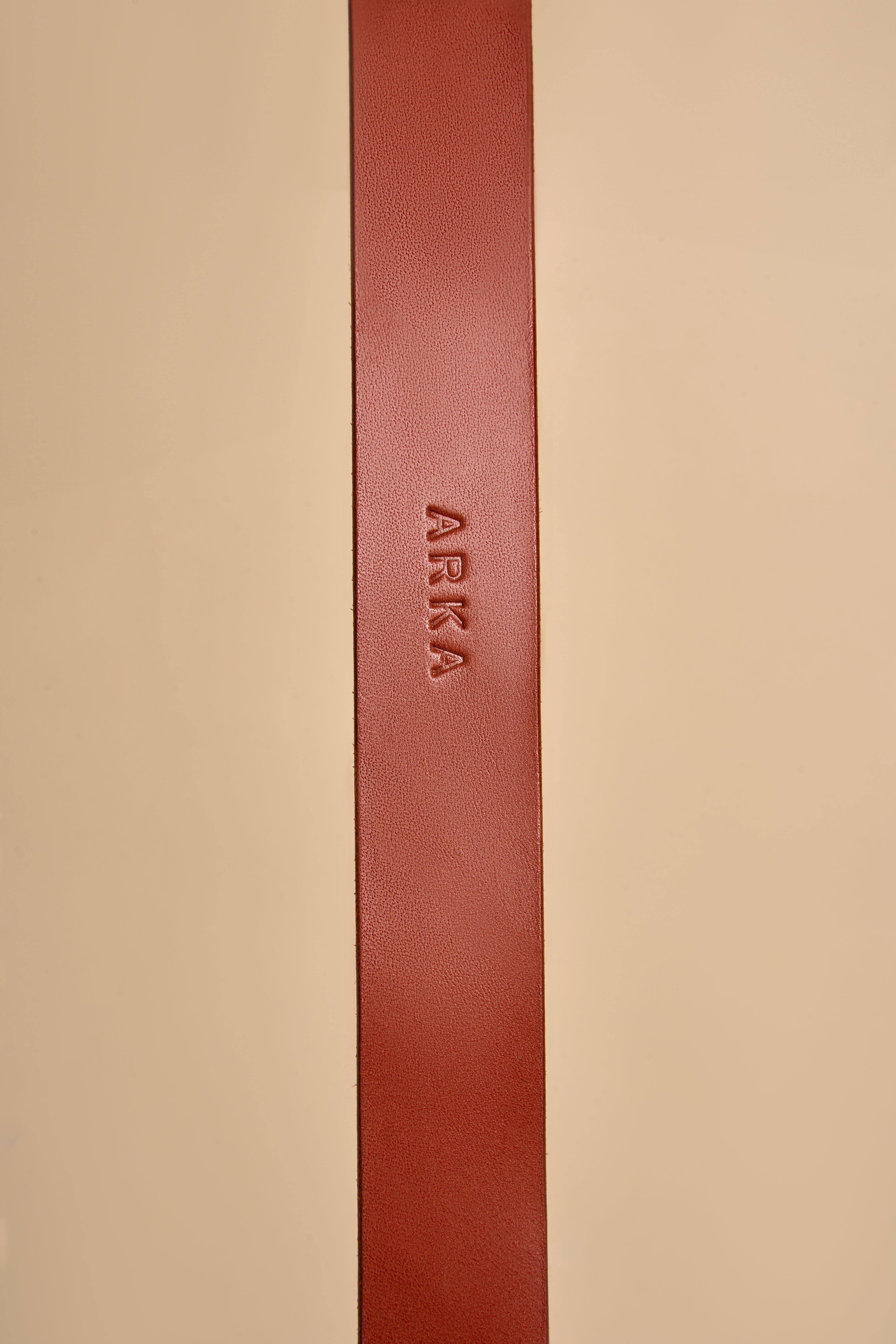 Close-up of personalized name embossing on Vero Classic Cognac Leather Dog Collar, showcasing custom leatherwork and premium materials