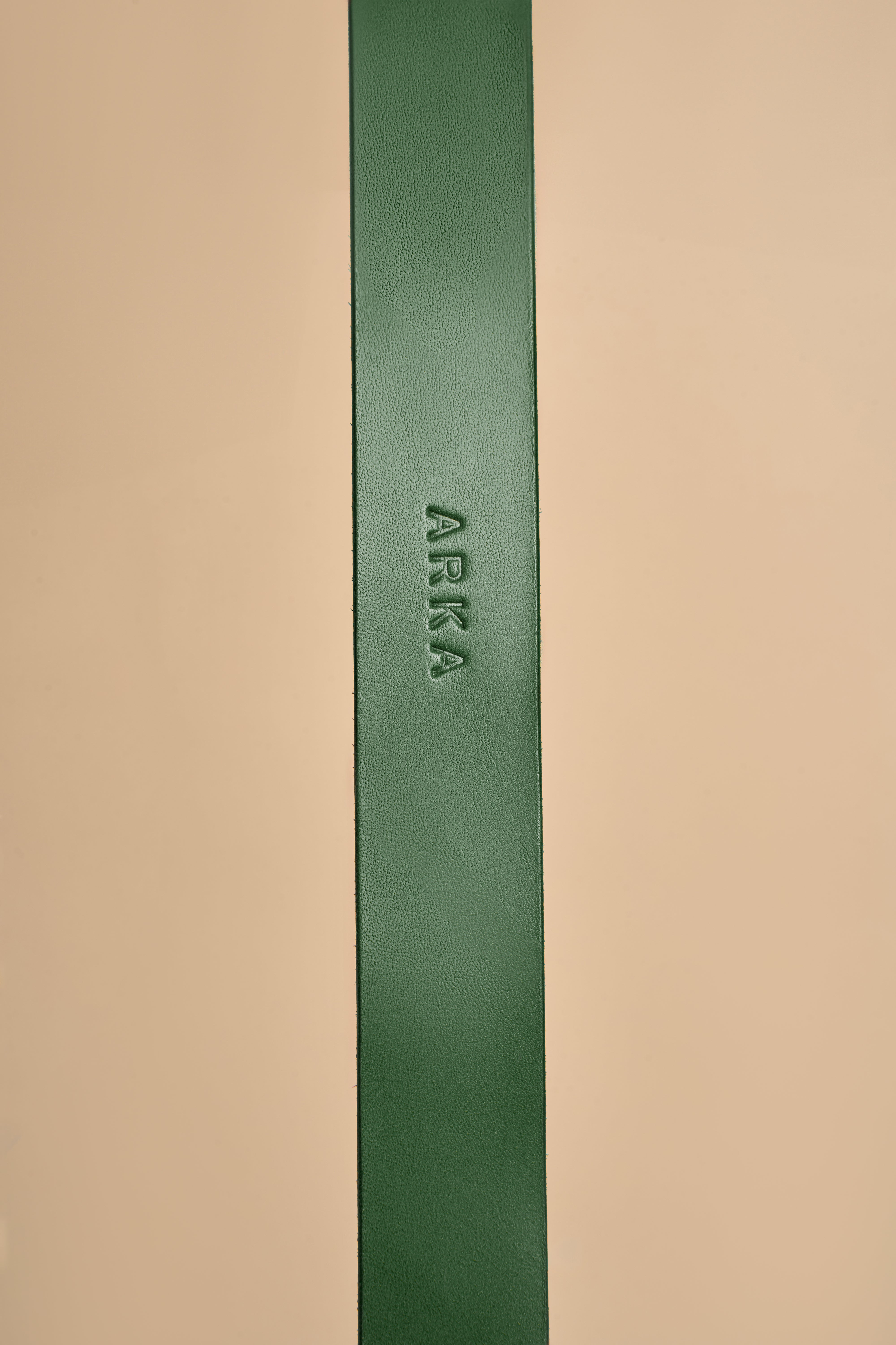 Detailed view of name embossing on Vero Classic Green Leather Dog Collar, offering customization options on high-quality Italian leather