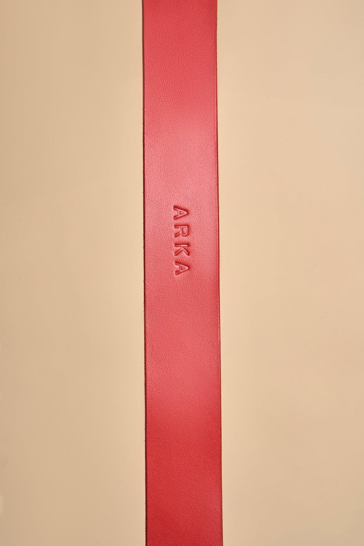 Close-up of personalized name embossing on Vero Classic Red Leather Dog Collar, crafted from premium leather for a customized fit