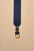 Detailed view of the brass buckle on Vero Wide Blue Leather Dog Collar, featuring premium Italian leather and durable hardware