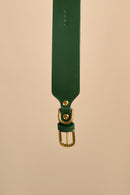 Detailed view of the brass buckle on Vero Wide Green Leather Dog Collar, crafted from durable Italian leather and solid hardware