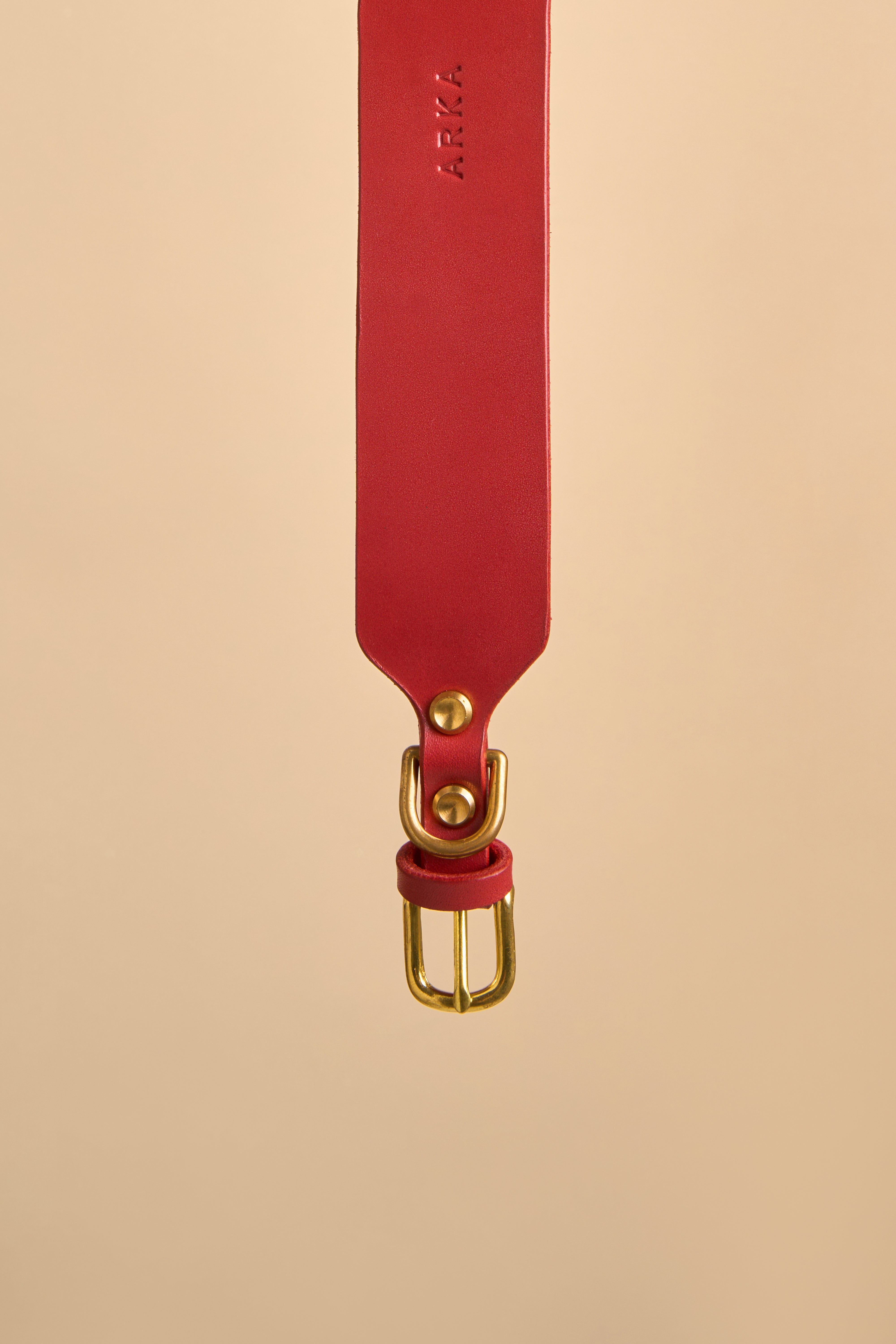 Close-up of the brass buckle on Vero Wide Red Leather Dog Collar, made from premium Italian leather for strength and durability